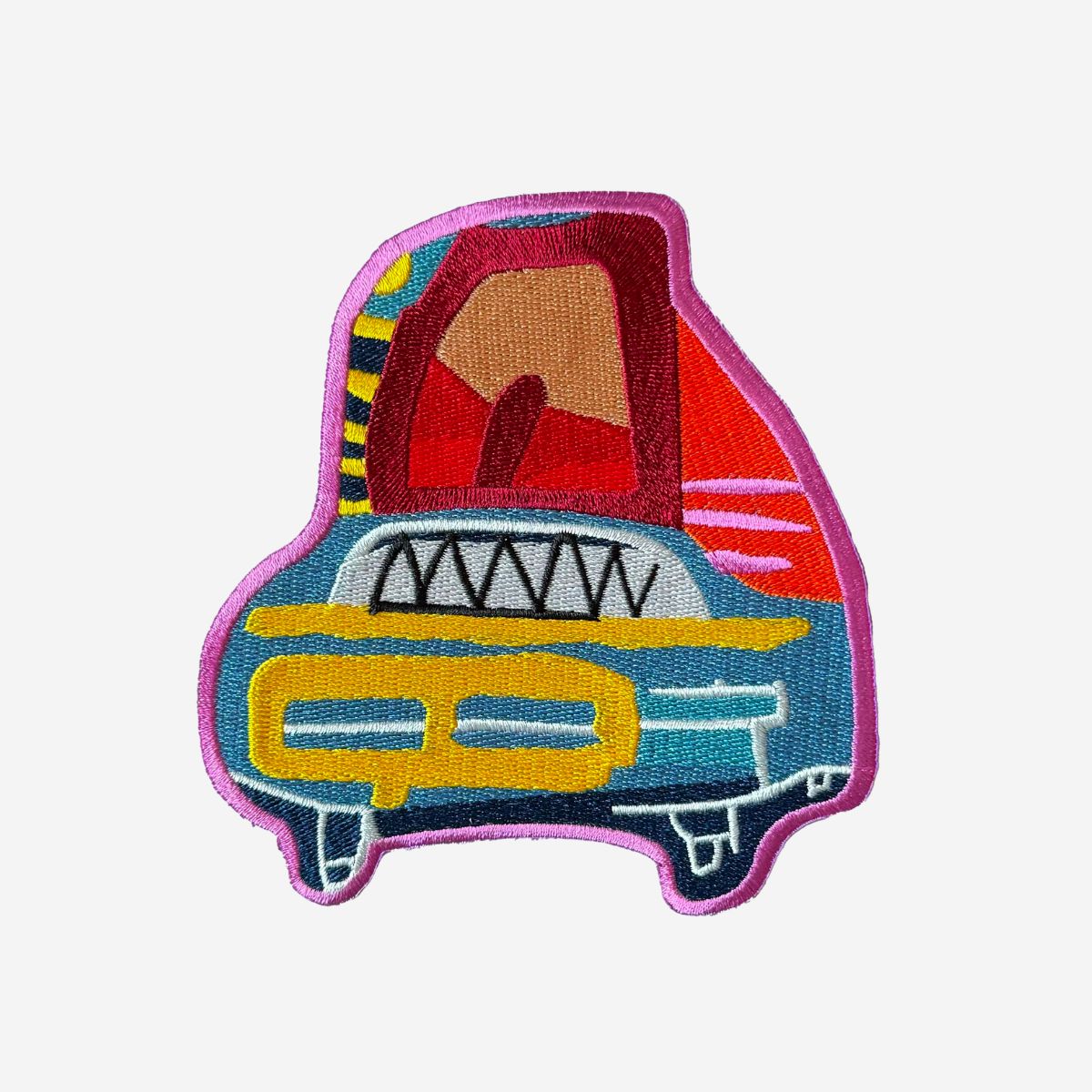 Colorful embroidered patch of a vintage car on a white background