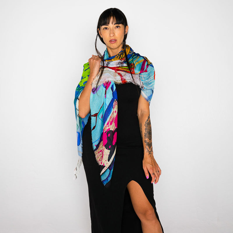 Woman wearing a colorful scarf on a white background