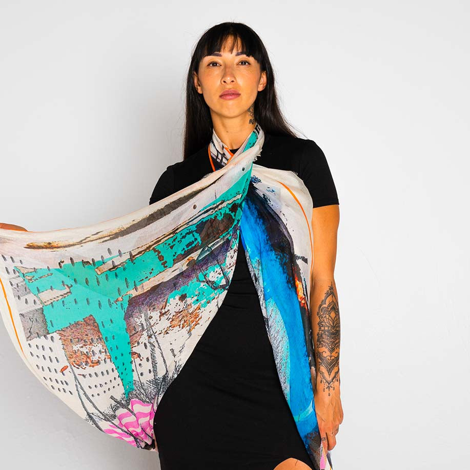 Woman holding a colorful scarf with a white background