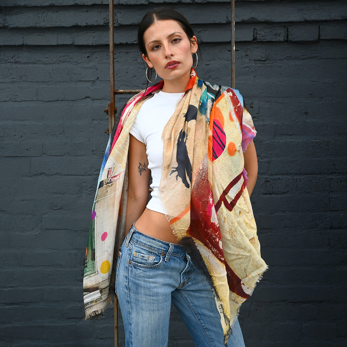 Moments Silk Scarf by Isabelle Gougenheim styled as an oversized wrap over a white top and jeans.